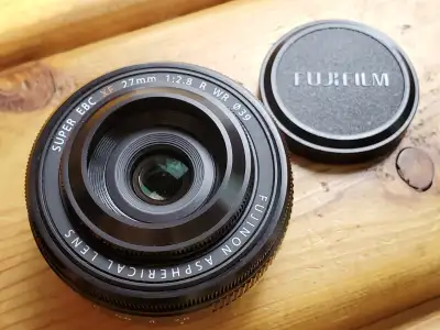 A pancake prime lens for Fujifilm X-mount. 41mm full-frame equivalent This is newer version with ape...