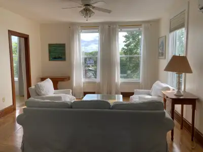 This bright, airy one bedroom apartment suits one person or a couple. One larger room fits a queen s...