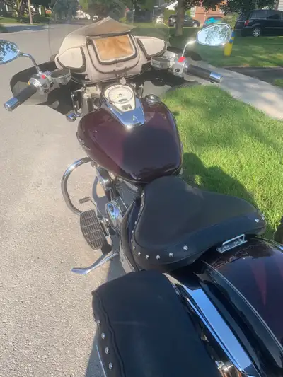Get ready to ride with this stylish burgundy cruiser motorcycle for sale! While it's a used bike, it...