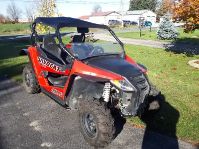 2015 Artic cat Wildcat Trail 700cc side by side. 1397 Miles, 239 Hrs. Accessories include roof, winc...