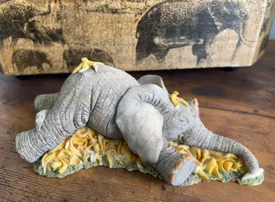 Set of two Tuskers collectable ornaments in original boxes. The price includes both of them. Have tw...