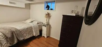 Furnished small room in a well-kept basement apartment. Includes full bed, coat hanger, mini desk, t...
