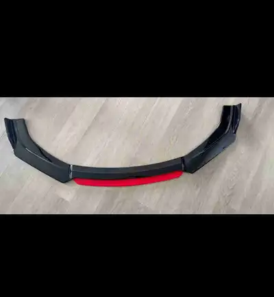 Enhance your vehicle's appearance with this sleek, used car lip, designed to add a sporty and aggres...