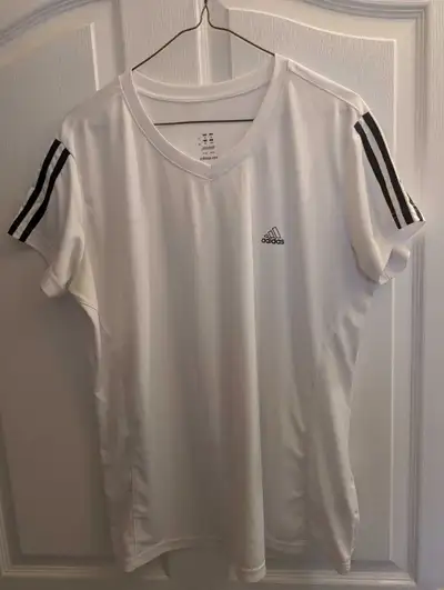 Two Addidas shirts ( long sleeve sweatshirt and short sleevet-shirt).Size L women's . Long sleeve co...