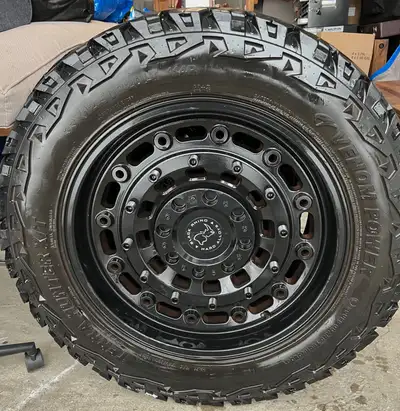 Selling a full set of 20x9.5 Black Rhino Arsenal rims in Matte Black paired with 33x12.50R20 Venom T...