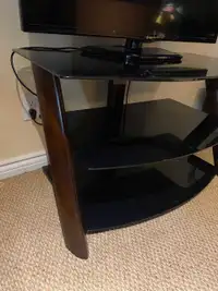 Glass tv table with wood legs. 