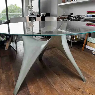 Molteni&C round Arc dining table with glass top and cement base, View more