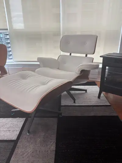 Reproduction iconic comfort with this white leather Eames lounge chair and ottoman, featuring a beau...