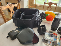 Nikon Camera, 3 lenses, bag, manuals, lens cleaner package