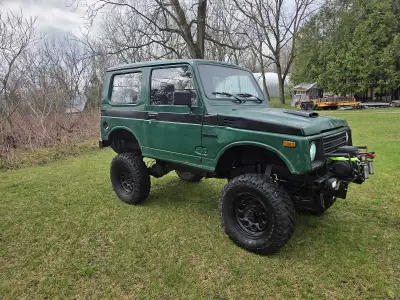 Get ready for your next off-road adventure with this rugged and capable 1985 Suzuki Samurai Tin Top....