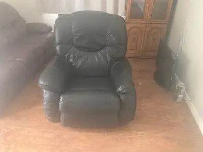 Black leather rocker/ recliner left arm rest distorted. Came from a no pet no smoking home. Maybe a...