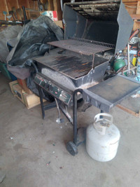 Used propane BBQ with tank and cover.