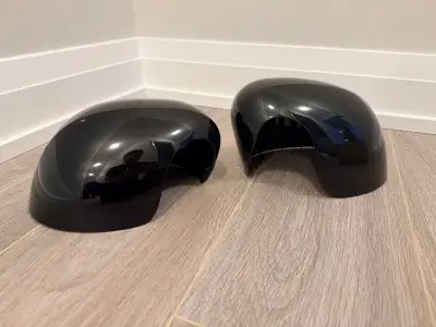 Mini Cooper black side mirror covers. According to the part numbers, these work with the following v...