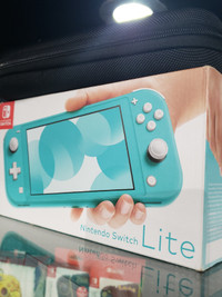 Nintendo Switch Lite with charger, case, and box
