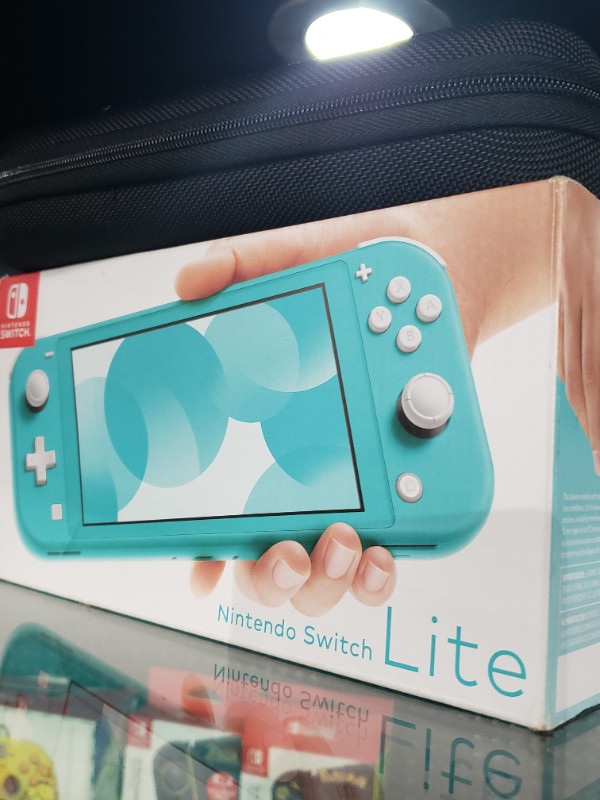 Nintendo Switch Lite with charger, case, and box in Nintendo Switch in Cole Harbour