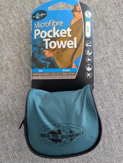 This is a new Sea to Summit microfibre pocket towel, small size, measuring 40cm x 80cm (16" x 32"),...