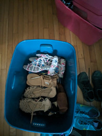 2 big plastic totes of shoes all in excellent condition