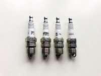 New Motomaster Spark Plugs V - Groove TRQ69. Four Pieces.