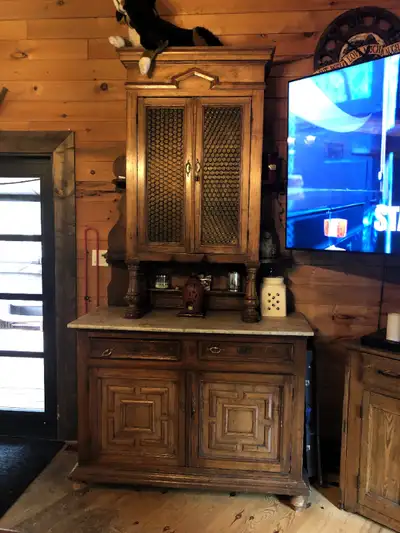 This unique antique buffet has a nice rustic feel. The top display cabinet can be mounted on the wal...