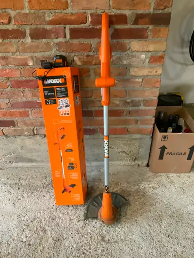 Cordless grass trimmer with charger, View more