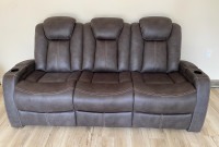 Power reclining couch with power headrest