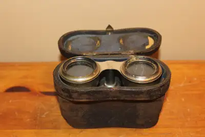 Hi. I have an old pair of field glasses or opera glasses with their original leather case for sale....