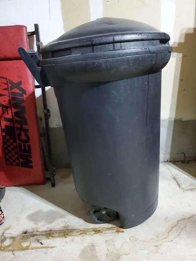 Large rubber maid garbage can with wheels for sale $10.