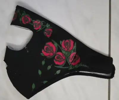 Lady's neoprene reversible face mask, black/white, with red roses. Used a couple times only. Great f...