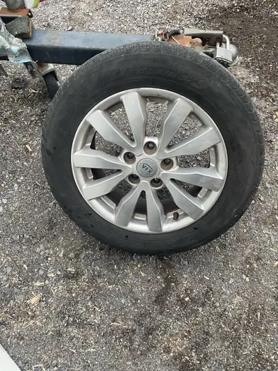 Four P205/60R16 summer tires. Rims are good, tires are worn. Came off Rondo