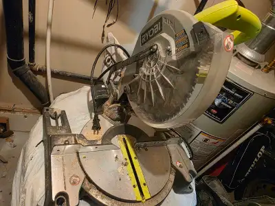 This Ryobi compound miter saw is a reliable tool perfect for tackling a variety of home improvement...