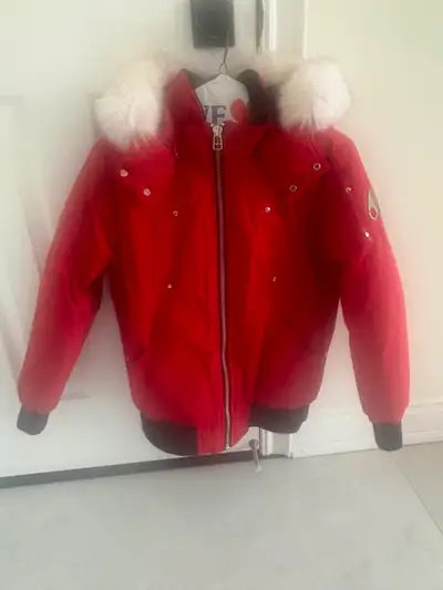 Kids size large red Moose Knuckles winter jacket. Child wore it for less than 2 months. One of the o...