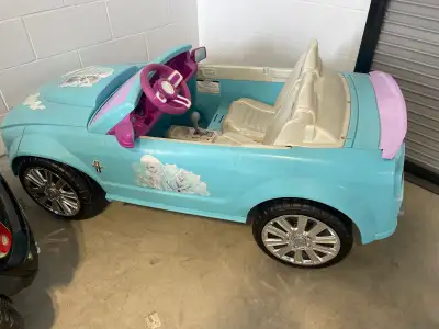 This is a used Frozen Mustang ride-on car for kids, featuring a vibrant blue colour and Disney's Fro...