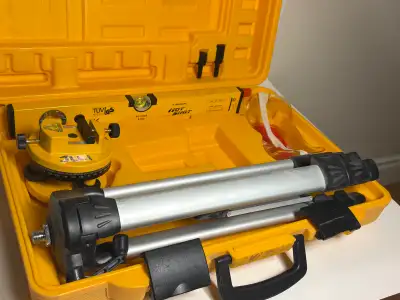 Johnson Hot Shot laser level setup in solid working condition — clean, organized, and ready for use....