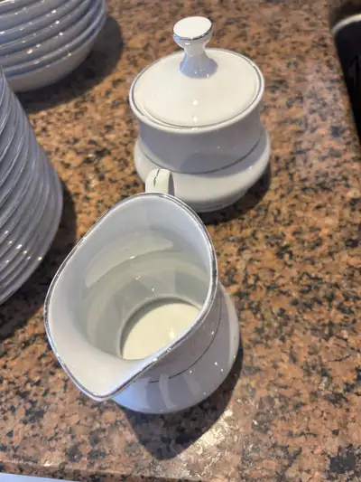 This set of China Pearl Annie Fine China, crafted in Liling China, includes an array of dinnerware p...