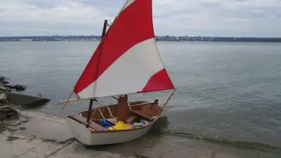 SAILING DINGY 8FT- MARINE PLYWOOD AND EPOXY-LIGHTWEIGHT INCLUDES- 2 LIFE JACKETS - OARS AND DOLLY