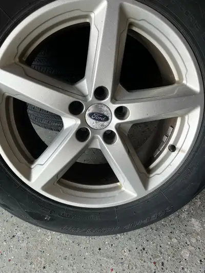 4 All Season Radial Tires with rims. Came off 2019 Ford Explorer. Size 245/60R18 One Rim damaged Pri...