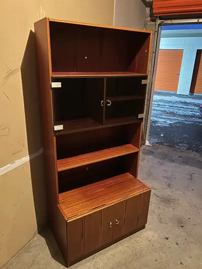 80$ 2.32 feet by 1.19 feet 5.71 feet high I'm selling a wooden bookcase with a lower cabinet. It has...