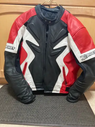 I'm selling my Joe Rocket motorcycle jacket, a size 42, featuring a striking red, white, and black d...