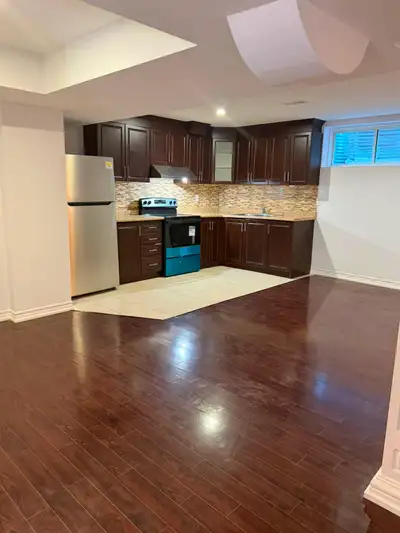 Fully renovated and spacious suite with modern open concept kitchen featuring chrome accents, modern...