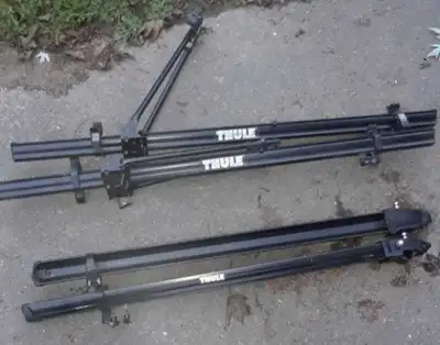 Two different models available of Thule roof top bike carriers One is front fork Mount other is fram...