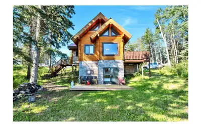 Escape to your own private retreat with this charming log cabin nestled on a beautifully treed acrea...