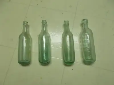 4-antique round bottom bottles, 1800's - early 1900's, hand blowen, sea green glass with minute air...