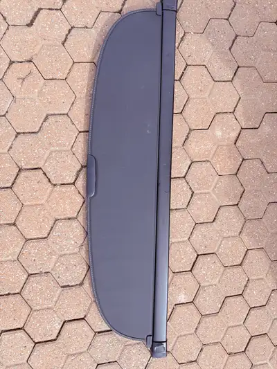 This is a Lexus RX350 cargo cover model number 64910-0E100-CO, perfect for keeping your belongings o...