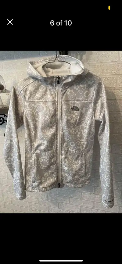 Light, feminine coat. It no longer has the size tag and I'm guessing it is a youth large or womens e...