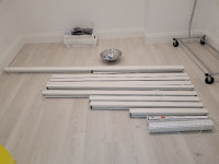 11 Roller Shades. Inside mount. Corded. White fabric.