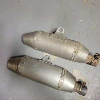 I have the stock mufflers off my 07 crf 250r may fit other years will be cleaned up before the go to...