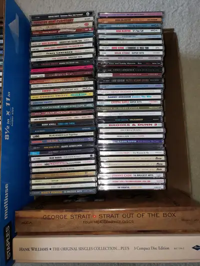 Assorted country and rock. 80s and 90s Selling as package only, will not split up. ~ 150 cds with a...