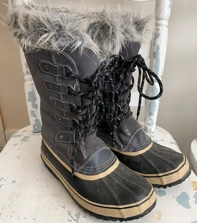 Knee high insulated winter boot. Leather upper, faux fur top, waterproof rubber foot and grippy outs...