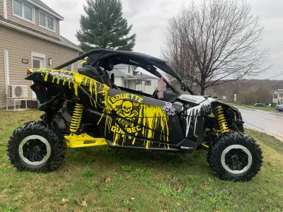 Je vends mon Can-Am Maverick usagé, un côte à côte performant avec un design distinctif en jaune et...