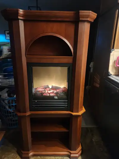 Working fireplace that can be used in a corner or against a flat wall. Asking $75.00 OBO